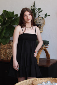 Cotton Smocked Tiered Mini Dress in Black